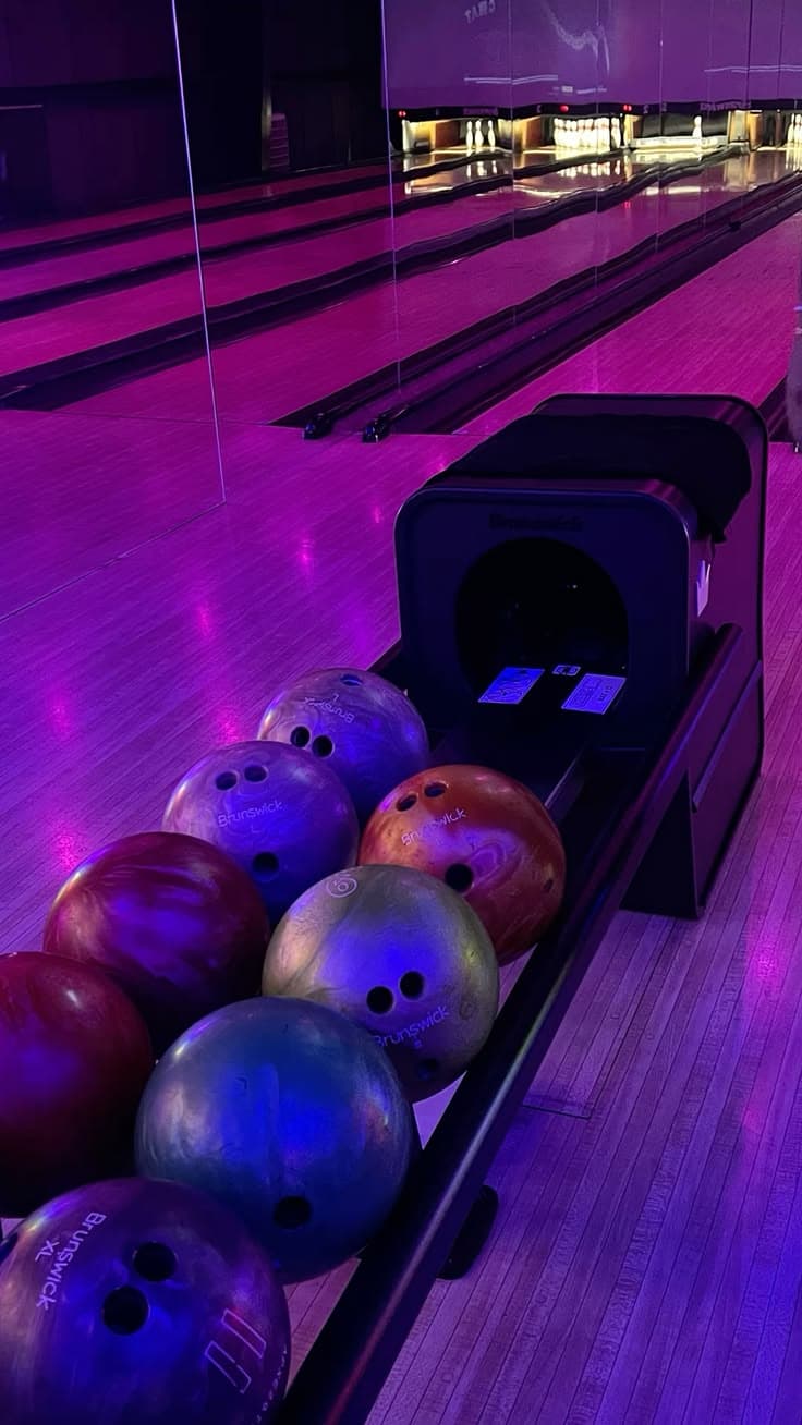 Bowling balls under neon light